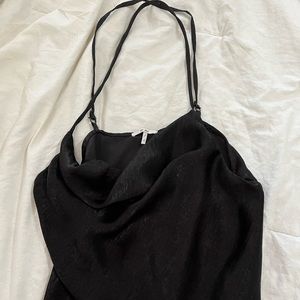 Black tank with cowl neck front. Cross strap back.